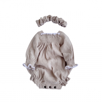 Muslin romper with ruffles and lace